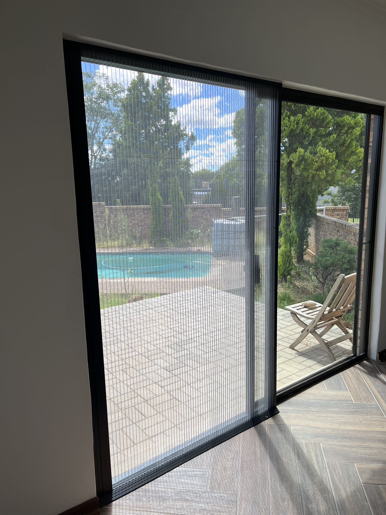 Custom sliding flyscreen at a residential doorway