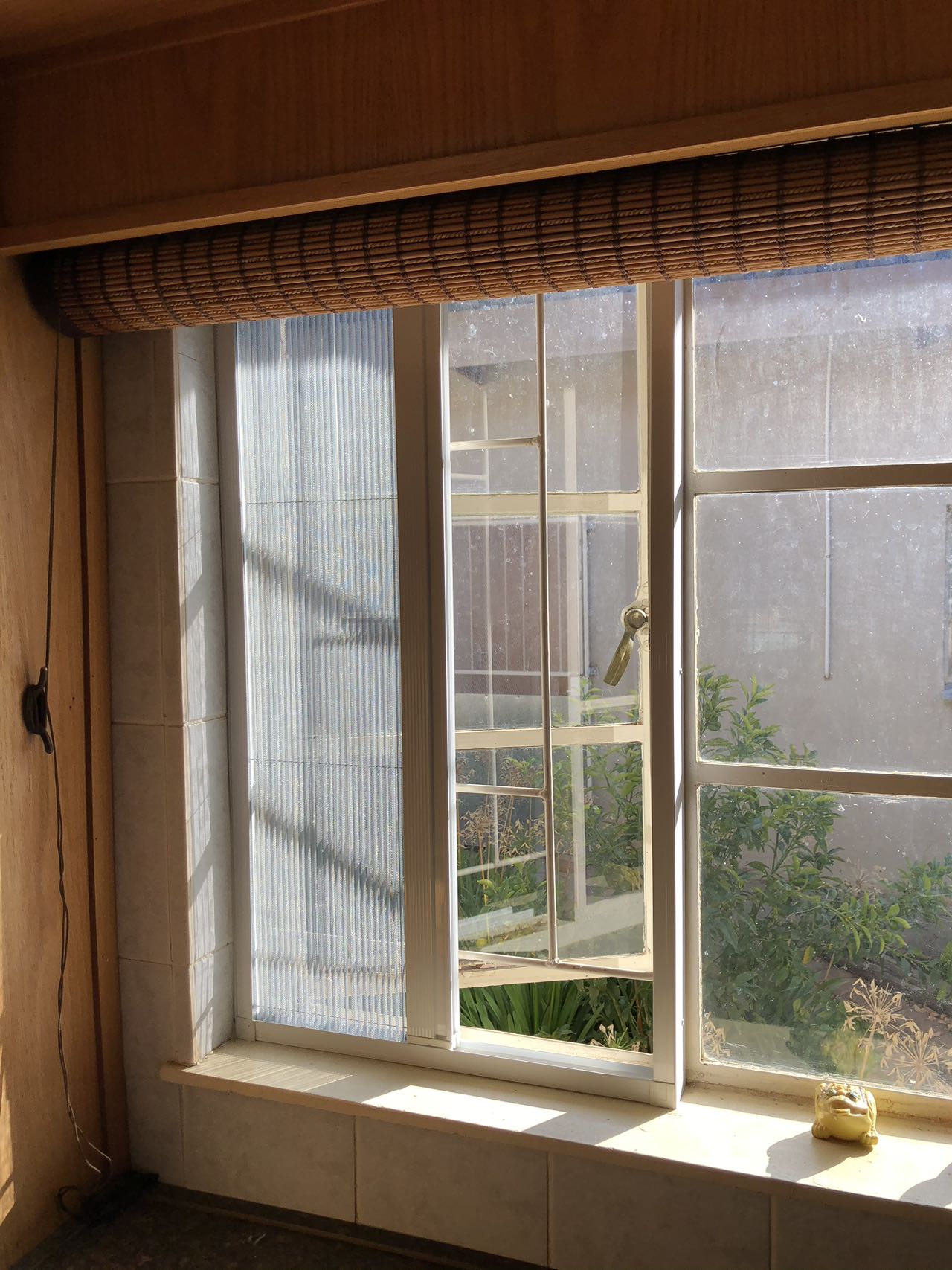 Pleated flyscreen installed at a residential window